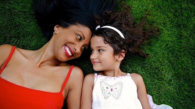 Mother and Daughter Laying Down